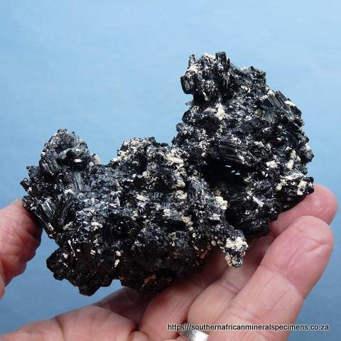 Excellent specimen of schorl crystals with hyalite opal and feldspar
