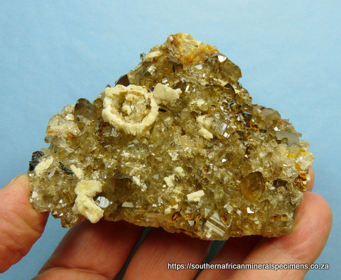 Smoky quartz, feldspar and schorl on matrix