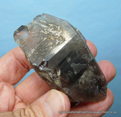 Double terminated smoky quartz crystal with inclusions