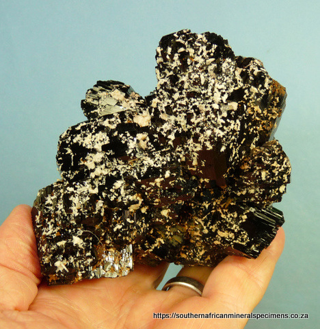 Schorl crystal specimen with feldspar and iron oxide