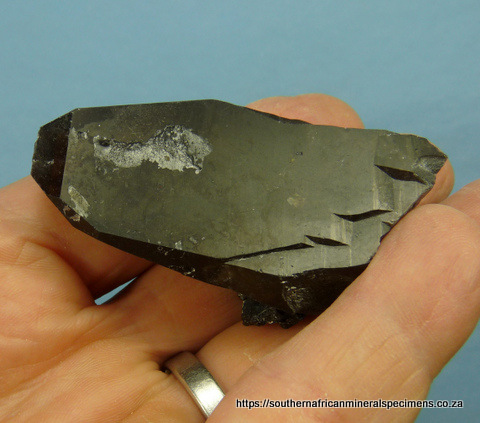 Smoky quartz crystal with hyalite opal