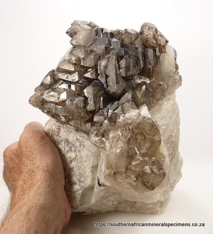 Smoky cathedral quartz with tourmaline, on matrix