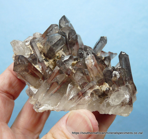 Quartz crystal cluster with hematite