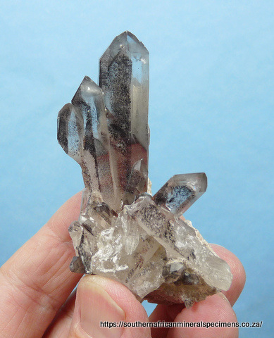 Quartz crystal group with hematite inclusions