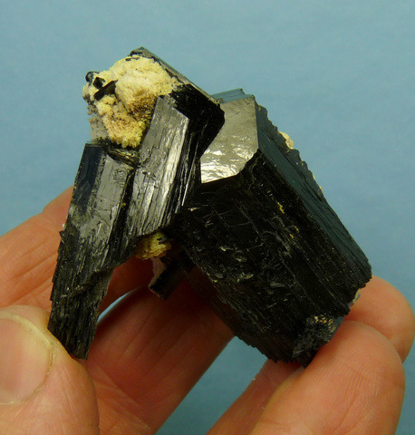 Double terminated schorl crystal group with bits of feldspar