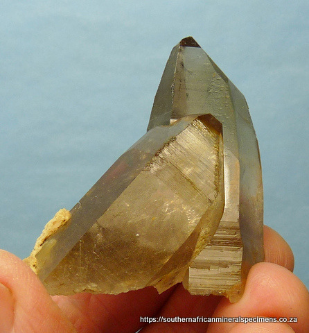Smoky quartz crystals with bits of feldspar