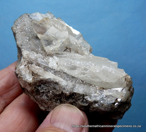 Clear cerussite bladed crystals on matrix