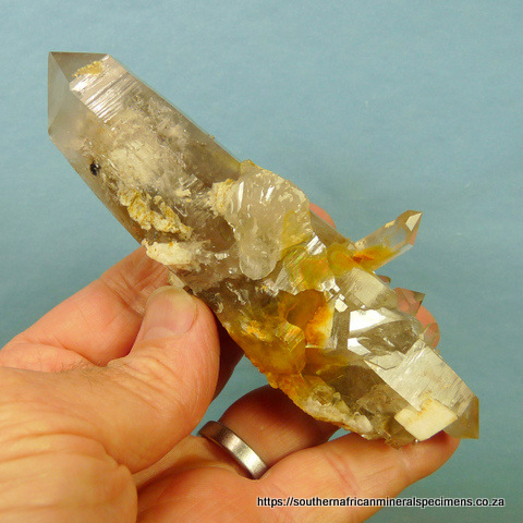 Double terminated quartz crystal with rutile, feldspa and dolomite