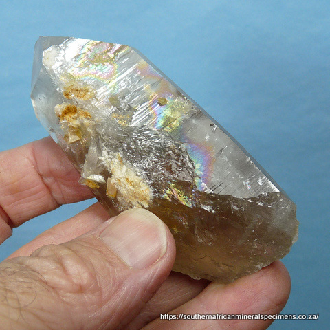 Smoky quartz crystal with surface rainbow
